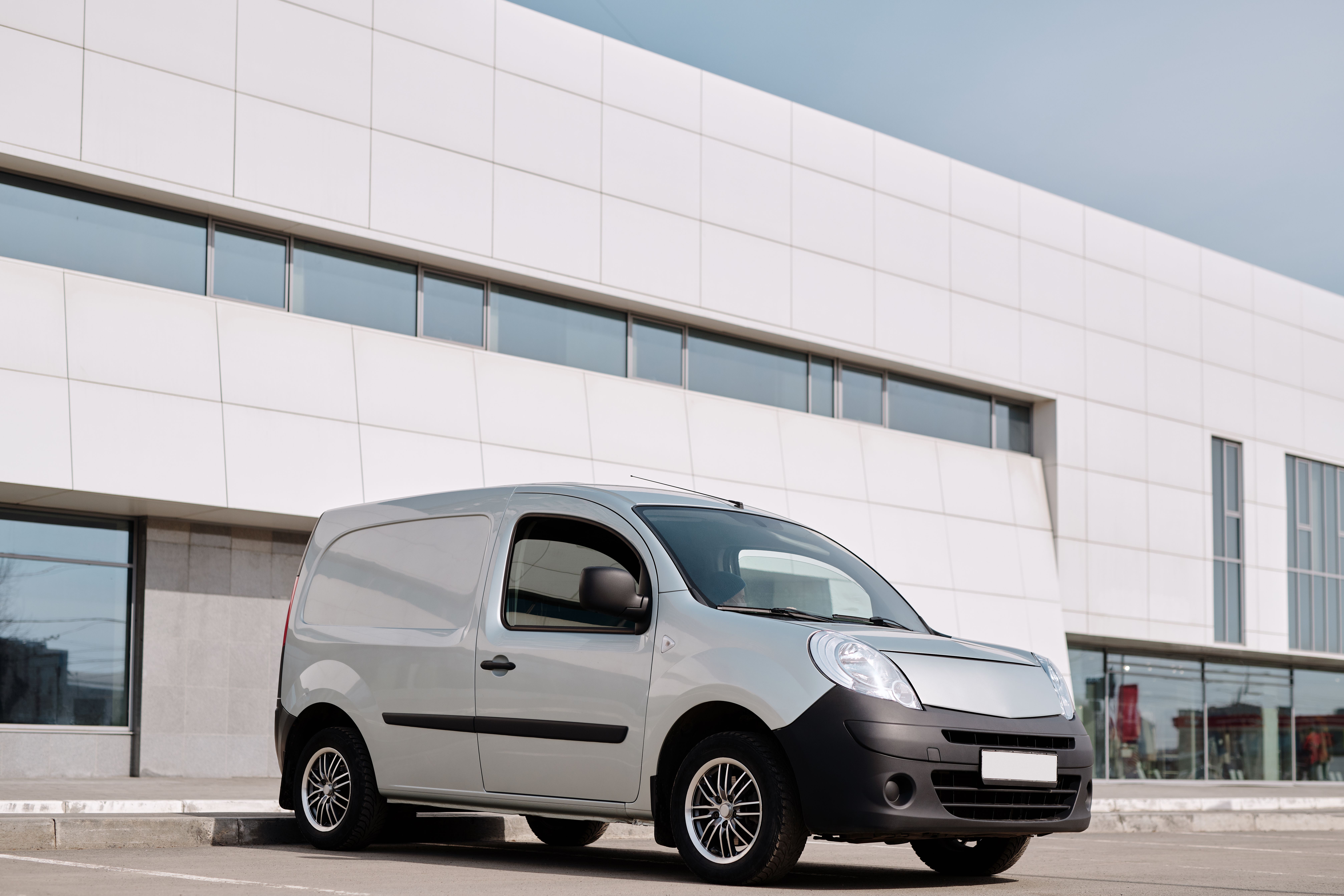 Commercial delivery van representing the restaurant's own delivery operation.